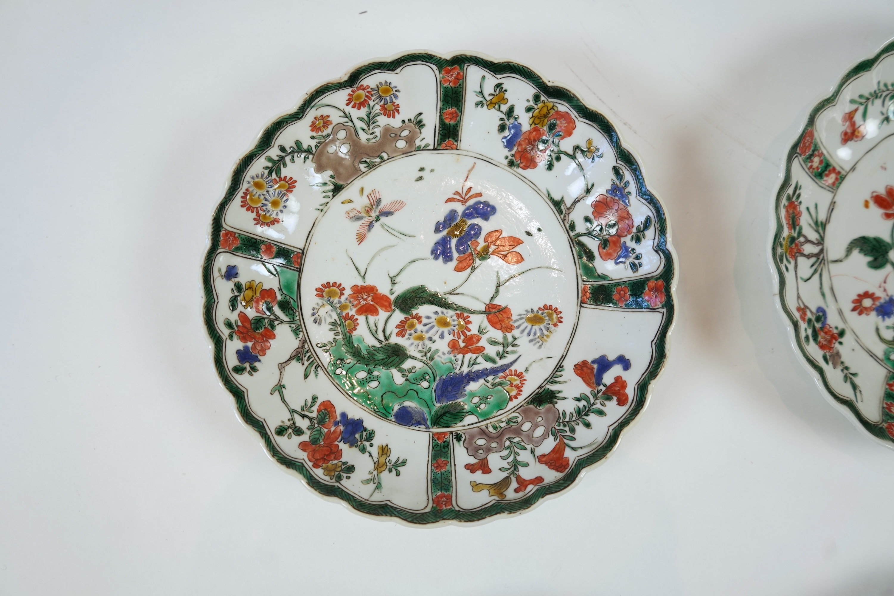 A set of six Chinese famille verte petal lobed saucer dishes, Kangxi period